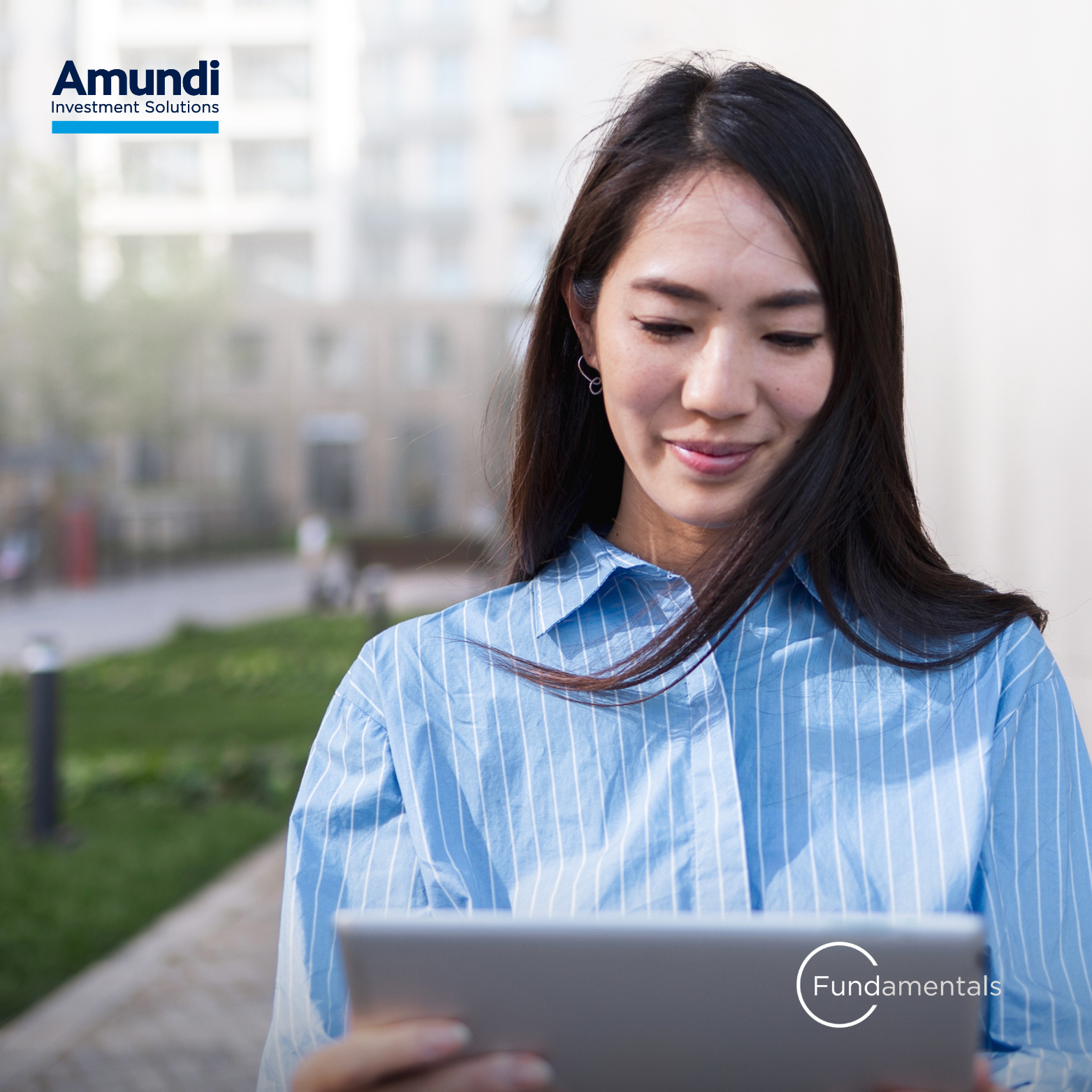 A woman looking at her tablet