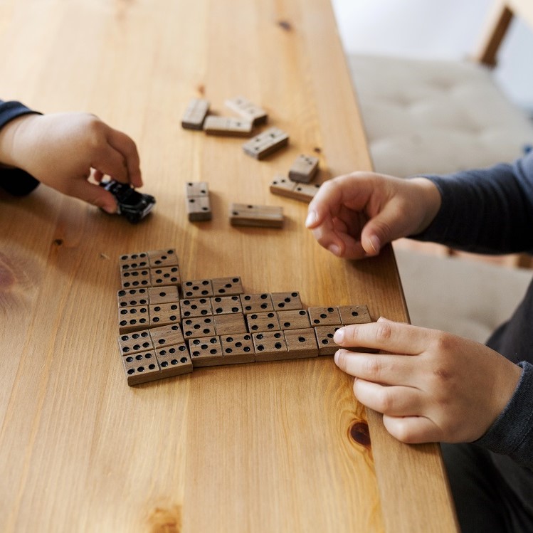 Kids playing with dominoes